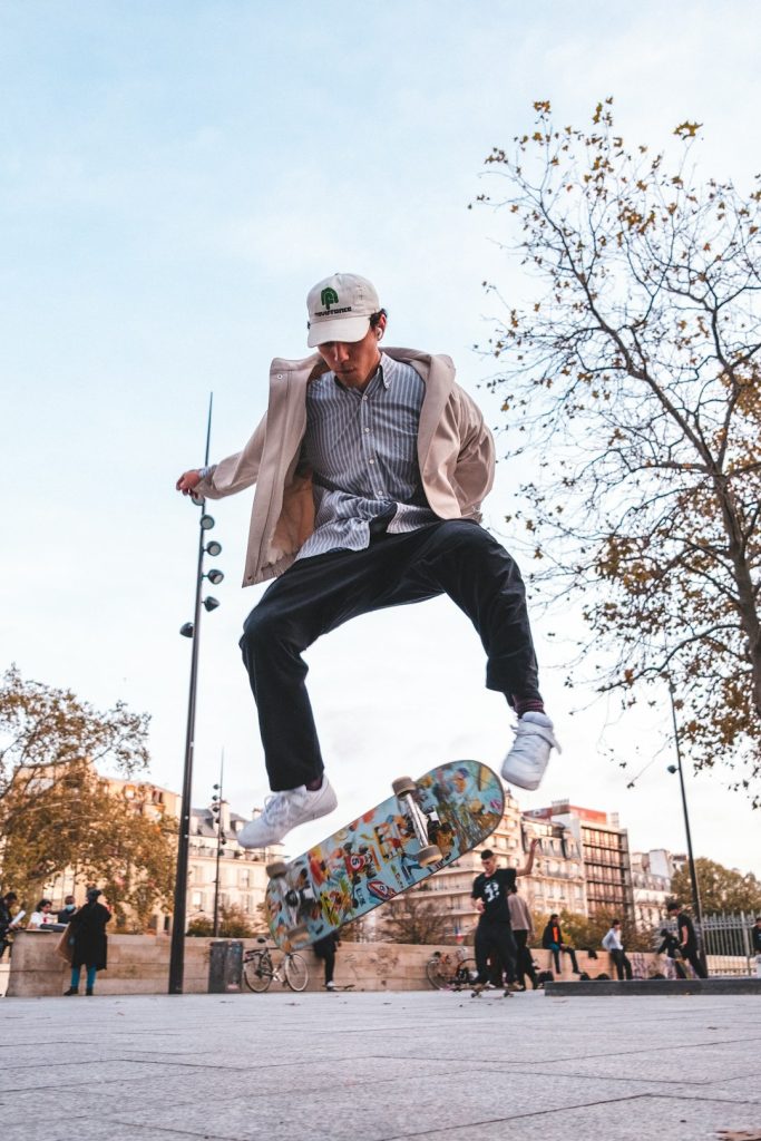 a-man-is-doing-a-trick-on-a-skateboard-vnetki625zu
